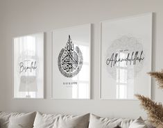 three framed pictures hang on the wall above a couch in a living room with pillows