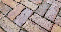 a close up view of an old brick sidewalk