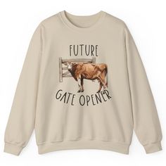 a white sweatshirt with an image of a brown cow that says, future gate opener