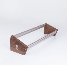 a wood and metal shelf on a white background