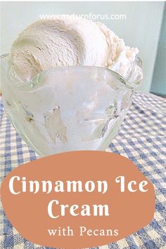 a glass bowl filled with ice cream sitting on top of a checkered table cloth