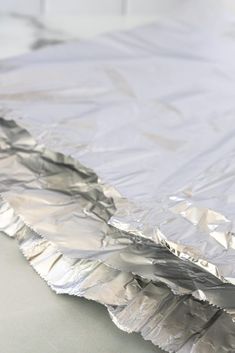 a piece of tin foil sitting on top of a table