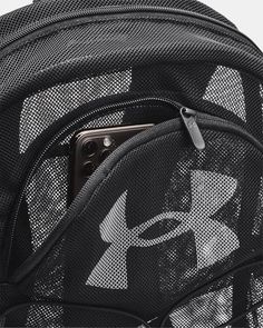 the back compartment of a backpack with an iphone in it