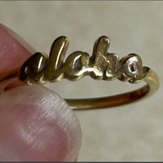 Beautiful ‘Aloha’ Script 14k Gold Ring! Recently Professionally Cleaned And Ready For A New Owner. Size Is 5.5mm. Made In Hawaii! Comes With The Box As Seen In Photos. Originally $425 Smoke And Pet Free Home! Maui Divers Guarantees Their Jewelry For Life. They Will Resize The Ring If You Need A Different Size By Simply Sending It In To Them. I Do Not Email, Text, Or Message Outside Of The Poshmark Platform. Please Ask Any Questions Before Purchasing. This Is The Exact Item You Will Receive. Sorry, No Cancellations. Please, No Low-Ball Offers. I Video The Wrapping And Packing Of All My Items.L 14k Gold Ring, Womens Jewelry Rings, Diver, Maui, For Life, Gold Ring, Gold Rings, Hawaii, Women Jewelry