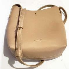 Samara Vegan Leather Handbag Purse Tan Long Crossbody Adjustable Strap Approx. 7x 8 X 3 Gold Button Latch. Open Inside. Lightweight. Excellent Condition. Looks Never Used. See Ohotos. Any Questions Please Ask. Thanks For Looking! Everyday Bucket Shoulder Bag With Snap Closure, Everyday Shoulder Bucket Bag With Snap Closure, Trendy Beige Shoulder Bag With Snap Closure, Everyday Crossbody Bucket Bag With Snap Closure, Casual Everyday Shoulder Bag With Button Closure, Everyday Crossbody Bucket Bag With Hasp Closure, Trendy Everyday Bucket Bag With Hasp Closure, Trendy Bucket Bag With Hasp Closure For Everyday, Everyday Bucket Bag With Snap Closure