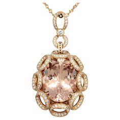 Embrace sophistication and allure with our stunning large oval cut morganite and diamond pendant necklace, expertly crafted in 14 karat rose gold. The centerpiece of this elegant piece is a mesmerizing oval cut morganite, renowned for its captivating peach-pink hue and exquisite brilliance. Set within an open loop design, the morganite is delicately framed by sparkling diamonds, enhancing its natural beauty and creating a captivating play of light. The 14 karat rose gold setting adds a touch of Luxury Morganite Jewelry Gift, Timeless Morganite Rose Gold Jewelry, Elegant Morganite Jewelry, Timeless Rose Gold Morganite Jewelry, Luxury Rose Gold Oval Pendant Jewelry, Elegant Rose Gold Morganite Jewelry, Luxury Oval Rose Gold Necklace, Luxury Rose Gold Oval Necklace, Elegant Yellow Gold Morganite Jewelry