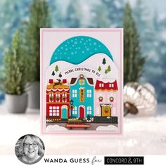 a handmade christmas card with a house