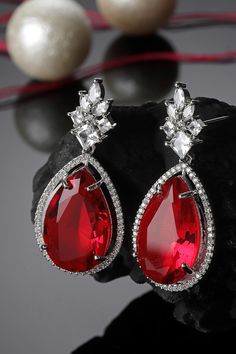 Product Features: Color: Red, Silver Material: Metal Work: American Diamond, Natural Stones Occasion: Festivewear, Partywear, Wedding Guest Product Type: Drop Earring Disclaimer: There will be slight difference in digital to actual image Loom Jewelry, Red And Silver, Red Diamond, Diamond Drops, Metal Work, American Diamond, Drop Earring, Silver Drop Earrings, Silver Material