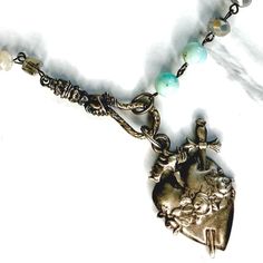 We've put a new twist on one of our best sellers 💙 We started off with shades of light blue agate, faceted crystals with rhodium chain. A vintage hand and gooseneck dupe holds the ex-voto heart, all metals are antiqued silver. Measures 22” in length with lobster clasp closure and some extension chain to play with length. All materials are free from cadmium, lead, and nickel. Limited Edition. Shades Of Light Blue, Shades Of Light, Custom Jewelry Design, Blue Agate, Faceted Crystal, Shop Necklaces, Heart Necklace, Custom Jewelry, Crystal Beads