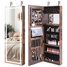 an open wooden jewelry cabinet with mirrored doors