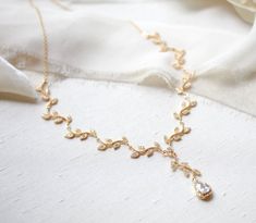 Lovely Rose gold dainty leaf Bridal necklace is perfect for any wedding or other special occasion. Romantic scrolled leaves encrusted with sparkly cubic zirconia stones. PLEASE ALLOW APPROX 10 BUSINESS DAYS FOR COMPLETION BEFORE SHIPPING.- Handcrafted with sparkly cubic zirconia components.- All clear stones - Rhodium, yellow gold or rose gold finish- Choose your necklace length from the drop down menu. Will come with a 2 inch extension chain on top of the length you choose.- Nickel free and hyp Clear Stone, Bridal Necklace, Necklace Length, Gold Finish, Or Rose, Original Designs, Necklace Lengths, Cubic Zirconia, Special Occasion