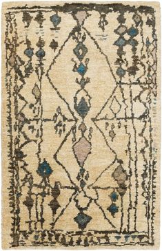 an antique rug with blue and beige designs on the front, in various colors and shapes