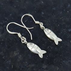 Fish Earrings, 925 Sterling Silver, Tiny Earrings, Fish Jewellery, Handmade Jewelry, Antique Earrings, Beach Jewellery, Christmas  Sale Product Details : Material : 925 Sterling Silver Earring Length : 40.5mm Approx Earring Width : 7mm Approx Earring Weight : 3.580 grams approx This jewellery is pure 925 Sterling silver and perfect for sensitive skin. Our product are totally hypoallergenic (perfect for sensitive skin) and made with high quality gemstones and 925 solid Sterling silver. Thank you Handmade Fish-shaped Earrings For Gifts, Silver Fish-shaped Earrings With Ear Wire, Handmade Silver Fish-shaped Earrings, Silver Sterling Fish-shaped Earrings, Silver Dangle Earrings With Fish Hook, Silver Fish-shaped Sterling Silver Earrings, Silver Drop Earrings With Fish Hook, Silver Fish-shaped Earrings With Fish Hooks, Nickel-free Silver Fish-shaped Earrings