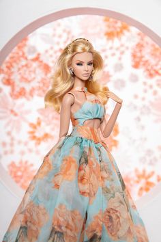 a barbie doll wearing a dress with flowers on it