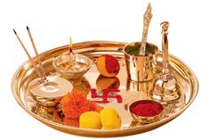 a gold tray with various items on it