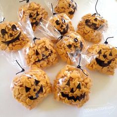 halloween treats are wrapped in plastic and have jack - o'- lantern faces on them