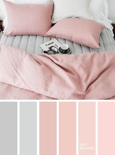 a bed with pink and grey sheets, pillows and blankets on top of each other