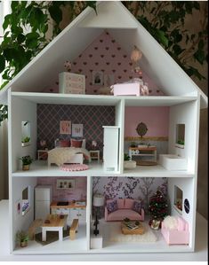 a doll house is shown with furniture and decorations