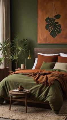 a bed with green sheets and pillows in a bedroom next to a painting on the wall