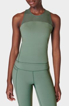 A built-in sports bra provides added support to this sweat-wicking mesh-yoke tank designed with cross-back straps and quick-drying abilities. 19" length (size Medium) Jewel neck Fixed straps Built-in bra Moisture-wicking fabric engineered for dryness and comfort 62% polyamide, 38% elastane Machine wash, dry flat Imported Sporty 4-way Stretch Activewear With Mesh Back, Sporty Tank Top With Built-in Bra For Yoga, Compressive Sleeveless Activewear With Built-in Bra, Green Tank Top With Built-in Bra For Yoga, Athletic Fit Activewear With Built-in Bra For Training, Compression Tank Top With Built-in Bra For Light Exercise, Sporty Tank Activewear With Built-in Bra, Athleisure Tank Top With Built-in Bra For Light Exercise, Compressive Green Activewear With Built-in Bra