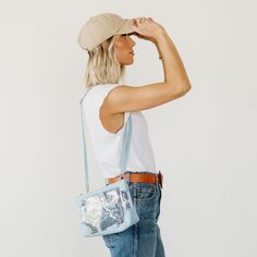 With a multi-purpose design, our Sharon Clear Crossbody is an essential. This clear bag has endless uses—as a clear bag for stadiums, or remove the strap and use for makeup , toiletries, diaper bag essentials, or as a storage option inside larger handbags, totes, duffle bags and suitcases. Need something smaller? Look at our Sharon Mini Clear Crossbody! Features Beautiful leather trim: Our buttery soft leather trims the bag in colors you’ll want to keep packing. ﻿Removable strap: ﻿Use the includ Trendy Shoulder Bag With Transparent Straps For Travel, Clear Shoulder Bag With Adjustable Strap, Clear Crossbody Shoulder Bag For On-the-go, Clear Strap Crossbody Shoulder Bag, Crossbody Shoulder Bag With Clear Strap, Daily Use Crossbody Bag With Clear Strap, Trendy Clear Plastic Travel Bag, Clear Shoulder Bag With Removable Pouch, Clear Crossbody Bag With Adjustable Strap