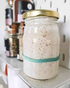 a mason jar filled with oatmeal sitting on top of a kitchen counter