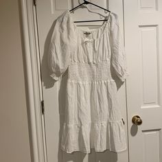 This Boston Proper White Peasant Style Dress Is A Canvas For Your Fashion Imagination! Go For A Natural For A Clean Crisp Look Or Add A Pop Of Color Jewelry For A Stand Out Statement! Size Medium New/Never Worn Location E-73 Spring Peasant Dress With Puff Sleeves, Spring Casual Peasant Dress With Ruffle Hem, Casual Spring Peasant Dress With Ruffle Hem, Spring Daywear Peasant Dress, Summer Peasant Dress With Puff Sleeves, Peasant Style Puff Sleeve Day Dresses, Spring Peasant Dress With Short Sleeves, Casual Summer Peasant Dress With Puff Sleeves, Spring Peasant Dress