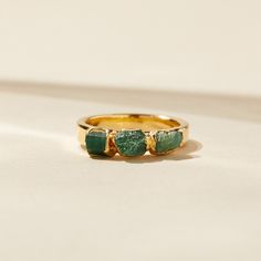 "EMERALD STACKING RING Meet the next Queen of your jewelry collection. This best-selling royal emerald ring is versatile enough to wear daily, and elegant enough to glam. Mix-and-match, wear alone, or accent a pop of color to any neutral outfit. Gift one to your May birthday sister, friend, or mother, or grab one for yourself - and dare to lead with your natural power. DETAILS * Width of ring band is 3mm * Lightly textured ring band * Heavy nickel-free 14k gold plate, recycled bronze metal * Eve Bohemian Wedding Ring, Raw Emerald Jewelry, Dare To Lead, Taurus Ring, Raw Emerald Ring, Emerald Statement Ring, Textured Ring Band, Emerald Stone Rings, Stackable Birthstone Rings