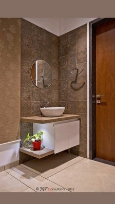 a bathroom with a sink and mirror on the wall