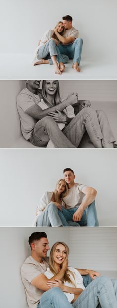 a man and woman sitting on top of each other in front of a white wall