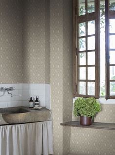 a sink and window in a small room