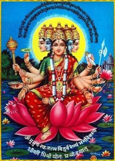 the hindu god sitting on top of a lotus in front of a body of water