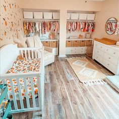 a baby's room with white furniture and lots of closet space, including a crib