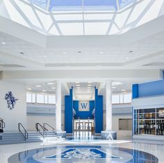 the inside of a building with blue and white walls