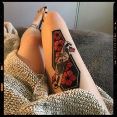 a woman with a tattoo on her leg