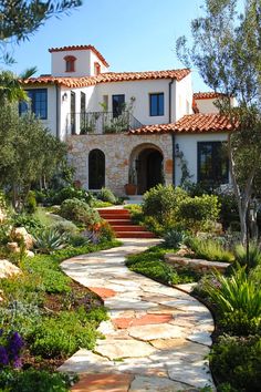 a house with a stone pathway leading to it