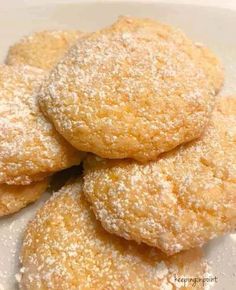 powdered sugar cookies stacked on top of each other