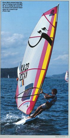 a person on a sail board in the water