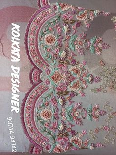 the back side of a pink and white book with embroidered flowers on it's cover