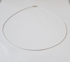 "New Omega Necklet 925 Sterling Silver  1.0mm ( chain thickness) 18\" (45cm) Weight approx 2.90g. Stamped 925 This delicate looking stylish neck piece is flexible with a sleek polished finish, looks good worn alone or with a pendant. Finished with a lobster clasp." Minimalist Sterling Silver Snake Chain Necklace, Minimalist White Gold Snake Chain Necklace, Solid Wire, Neck Piece, Lovely Earrings, Best Wear, Chain Styles, Sterling Silber, Chains Necklace