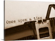 an old typewriter with the words once upon a time printed on it's paper