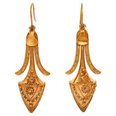 Circa 1880s, 14k, American. These nineteenth-century Etruscan revival earrings are elegant, flirty, and visually arresting. Fabulous length combined with exciting movement, fine detail, and a lovely patina makes them as fashionable today as they were over a hundred years ago. The look is neoclassical chic at its antique best! Finely made in fourteen-karat yellow gold, they are in excellent condition. Remarks: "The Victorians borrowed from everyone and we borrow from them. Fashion is now, style is forever!" SIZE: 2 1/4 inches long WEIGHT: 6.4 grams total STONES: none HALLMARKS: none, tested 14k STOCK NUMBER: 25090 Pieces acquired from this dealer must delight you. Purchases may be returned for any reason for a period of 7 days. The Borrowers, Antique Jewelry, Style Me, Period, Size 2, Jewelry Earrings, Yellow Gold, Drop Earrings, Stone