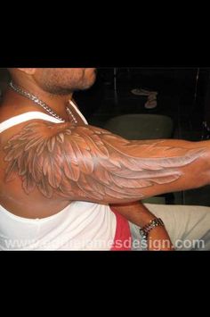 a man with large wings on his arm