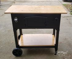 an old fashioned stove on wheels is being used as a cart