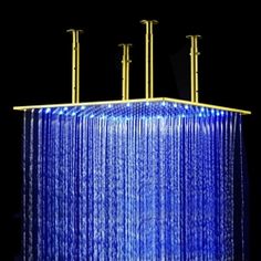 the rain shower head is illuminated with blue lights