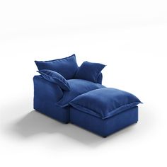 a blue couch with pillows on it and a pillow in the shape of a recliner