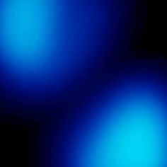 two blue balls are shown in the dark