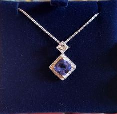 This listing is to give you an idea of price should you be interested in this 7 mm AAAA Certified square cut Tanzanite surrounded with 2mm Si G to H Diamonds and a 4 mm square cut Diamond in 18k White Gold.   Simply contact us for a price.  Prices vary dependent on the following: gemstone/s used metal used (sterling silver or gold) carat weight If Tanzanite, the grade used If Diamonds, the grade used   In the first instance, please contact us to discuss your own personal requirements.  Lead time Formal Rectangular Fine Jewelry Gemstones, Formal Tanzanite Jewelry With Diamond Accents, Brilliant Cut Tanzanite Gemstones For Gift, Brilliant Cut Tanzanite Gemstones As Gift, Asscher Cut Tanzanite Fine Jewelry, Elegant Rectangular Gemstones For Formal Occasions, Elegant Rectangular Gemstones For Formal Events, Formal Princess Cut Sapphire Jewelry, Elegant Tanzanite Diamond Cut Jewelry