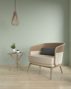 a chair and table in a room with light green walls, white tile floors and wood flooring