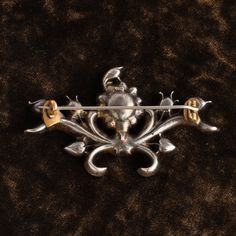 This exquisite floral brooch is made in silver and set with warm champagne-toned topaz and bright amethysts. Topaz is believed to derive its name from either the ancient Sanskrit word topas meaning "fire", or for the old Greek island of Topazios. The gemstone occurs in many places throughout the world, as well as in varied colors including yellow, blue, and colorless to name a few. Topaz mines were discovered in Brazil in the 17th century, and seeing as it was a Portuguese-held territory at the Sanskrit Words, Floral Brooch, Greek Island, Sanskrit, 17th Century, Yellow Blue, 18th Century, The Old, Topaz